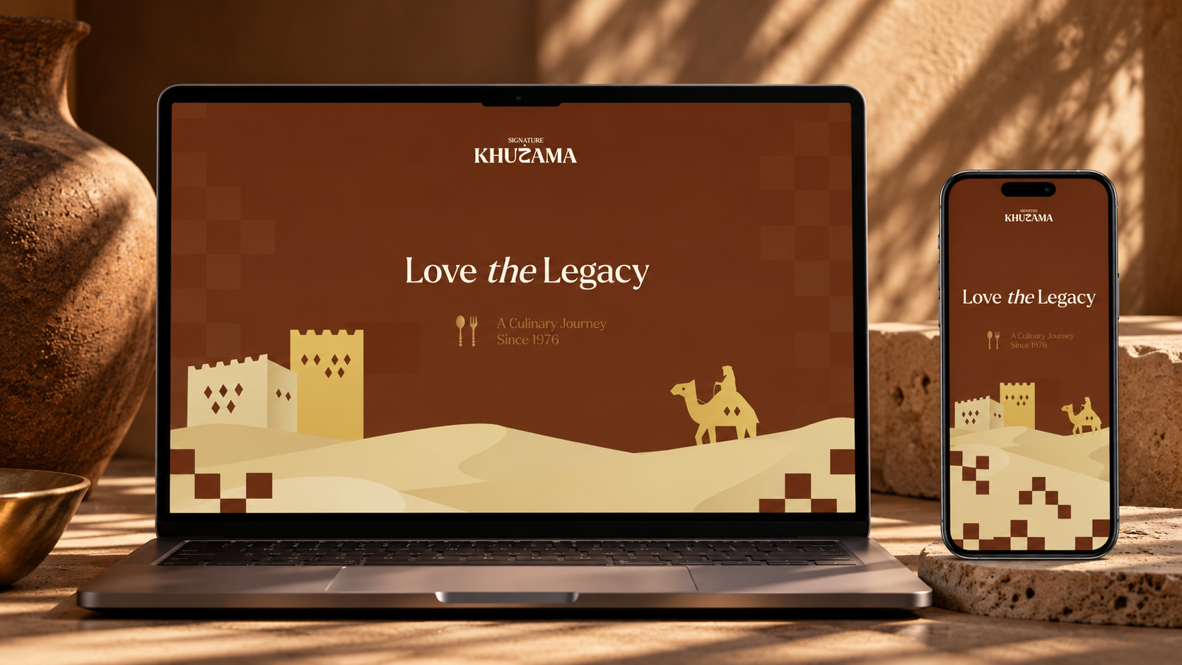 Khuzama Signature website displayed on a laptop and mobile phone in a warm editorial setting